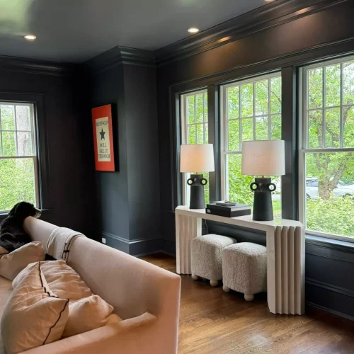Thoroughly vacuumed and dusted sitting room with large windows